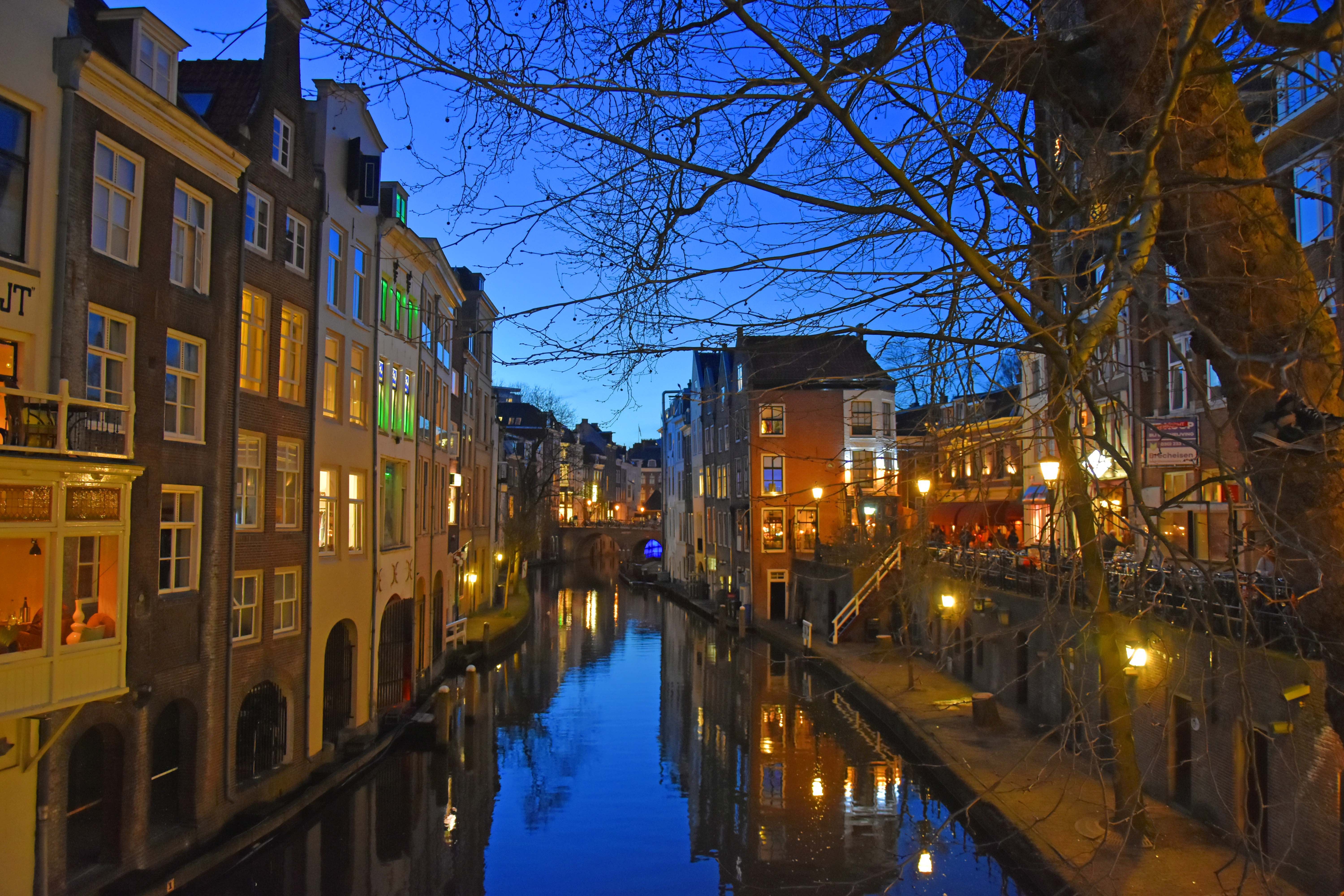 Evening view of a canal with historic buildings in the Netherlands.